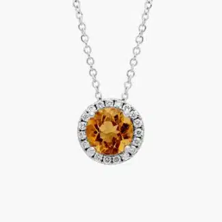 A Citrine and Diamond Halo Pendant in 14K White Gold, featuring a 1.2 CTW citrine, a classic suggestion among Luxury Push Present Ideas.