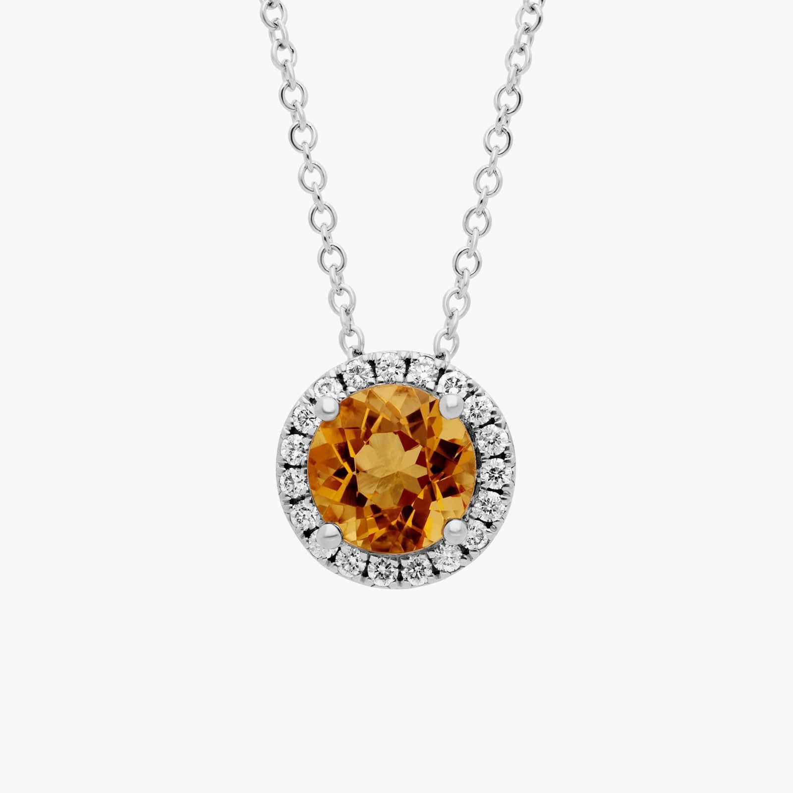 A Citrine and Diamond Halo Pendant in 14K White Gold, featuring a 1.2 CTW citrine, a classic suggestion among Luxury Push Present Ideas.