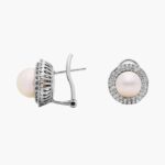 A pair of Classic Akoya Cultured Pearl Double Halo Diamond Earrings, 1.01 CTW set in 18K White Gold with Omega Clip backings.
