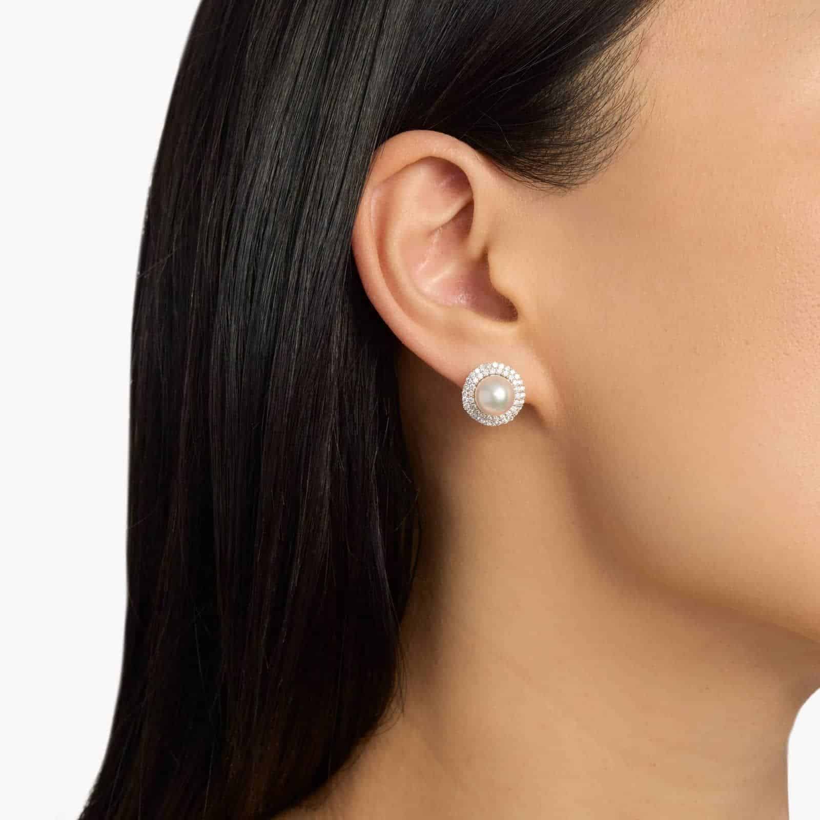 Classic Akoya Cultured Pearl Double Halo Diamond Earrings in 18k White Gold model view A model wearing the large 8.5mm Akoya Pearl and Diamond Double Halo Earrings, showcasing the impressive size and brilliant sparkle near the earlobe.
