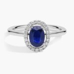 A Floating Oval Sapphire and Diamond Micropavé Halo Ring (7x5mm sapphire, 0.14 CTW diamond) in 14K White Gold, a colorful and elegant option among Luxury Push Present Ideas.
