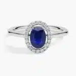 A Floating Oval Sapphire and Diamond Micropavé Halo Ring (7x5mm sapphire, 0.14 CTW diamond) in 14K White Gold, a colorful and elegant option among Luxury Push Present Ideas.