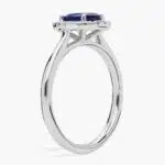 A Floating Oval Sapphire and Diamond Micropavé Halo Ring (7x5mm sapphire, 0.14 CTW diamond) in 14K White Gold, a colorful and elegant option among Luxury Push Present Ideas.