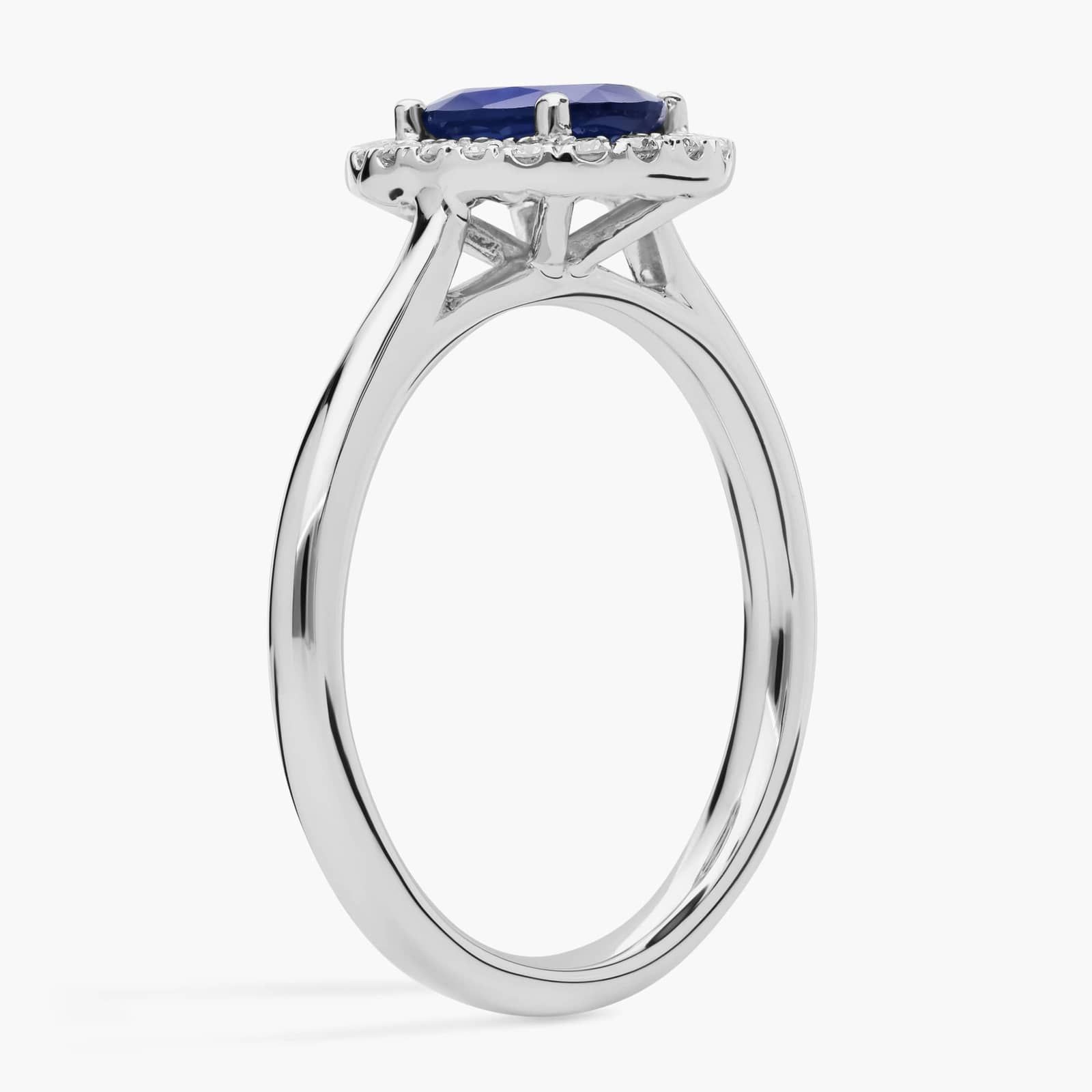 Floating Oval Sapphire and Diamond Micropavé Diamond Halo Ring in 14k White Gold 2 A Floating Oval Sapphire and Diamond Micropavé Halo Ring (7x5mm sapphire, 0.14 CTW diamond) in 14K White Gold, a colorful and elegant option among Luxury Push Present Ideas.