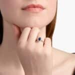 A Floating Oval Sapphire and Diamond Micropavé Halo Ring (7x5mm sapphire, 0.14 CTW diamond) in 14K White Gold, a colorful and elegant option among Luxury Push Present Ideas.