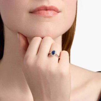 A Floating Oval Sapphire and Diamond Micropavé Halo Ring (7x5mm sapphire, 0.14 CTW diamond) in 14K White Gold, a colorful and elegant option among Luxury Push Present Ideas.