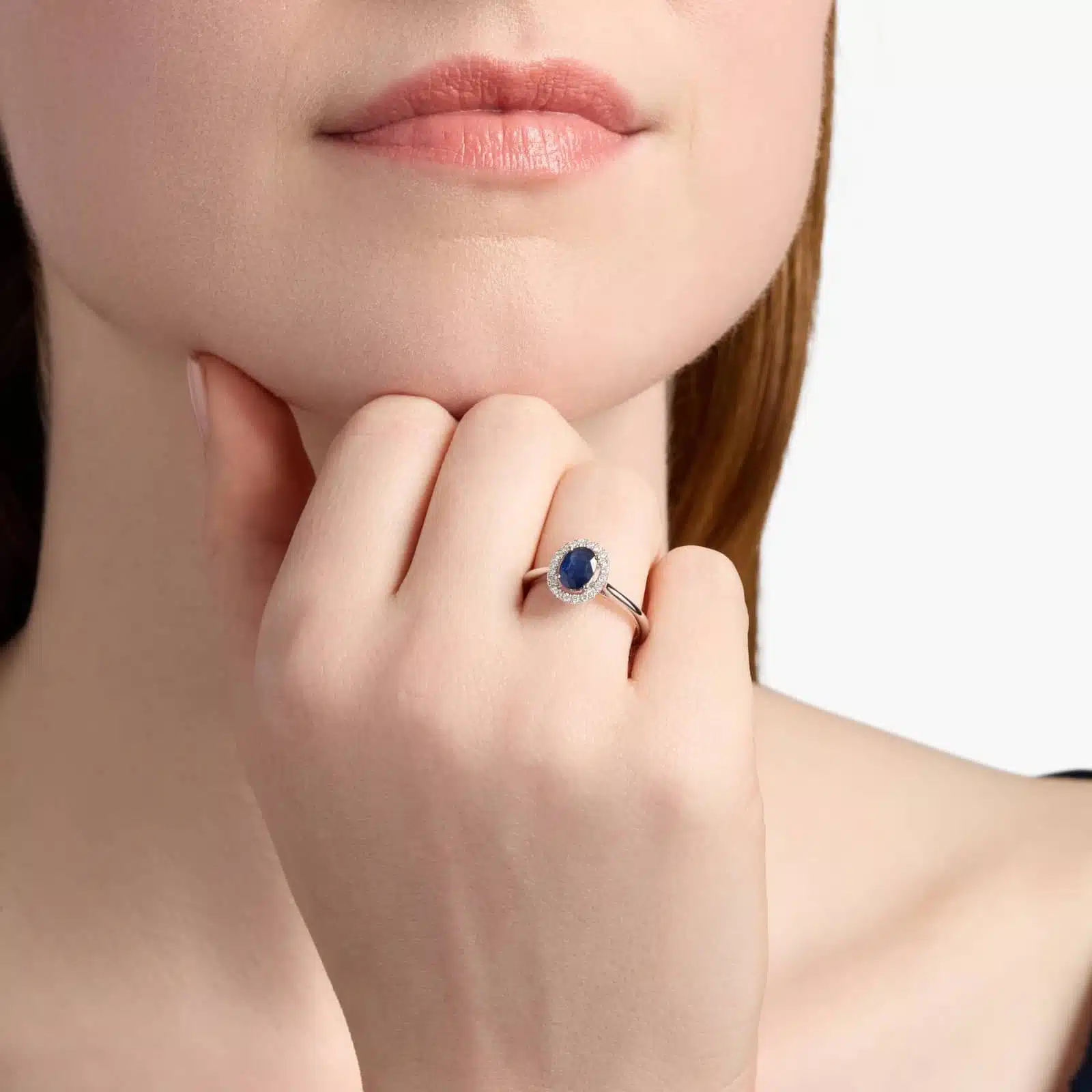 Floating Oval Sapphire and Diamond Micropavé Diamond Halo Ring in 14k White Gold model view A Floating Oval Sapphire and Diamond Micropavé Halo Ring (7x5mm sapphire, 0.14 CTW diamond) in 14K White Gold, a colorful and elegant option among Luxury Push Present Ideas.