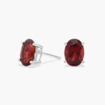 A pair of Oval Garnet Stud Earrings in 14K White Gold, a stylish and affordable option among Luxury Push Present Ideas and birthing gifts for mom.