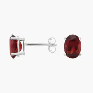 A pair of Oval Garnet Stud Earrings in 14K White Gold, a stylish and affordable option among Luxury Push Present Ideas and birthing gifts for mom.