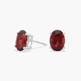 A pair of Oval Garnet Stud Earrings in 14K White Gold, a stylish and affordable option among Luxury Push Present Ideas and birthing gifts for mom.