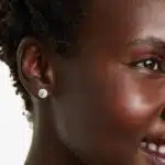 A pair of 1 CTW Halo Diamond Stud Earrings in 14K White Gold with H-I/SI clarity, an excellent choice for Luxury Push Present Ideas and diamond earrings push present gifts.