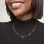 A personalized station initial necklace in 14K White Gold featuring 0.95 CTW lab-grown diamonds in a bezel setting, one of the best Luxury Push Present Ideas.