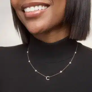 A personalized station initial necklace in 14K White Gold featuring 0.95 CTW lab-grown diamonds in a bezel setting, one of the best Luxury Push Present Ideas.