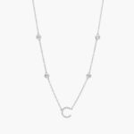 A personalized station initial necklace in 14K White Gold featuring 0.95 CTW lab-grown diamonds in a bezel setting, one of the best Luxury Push Present Ideas.