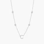 A personalized station initial necklace in 14K White Gold featuring 0.95 CTW lab-grown diamonds in a bezel setting, one of the best Luxury Push Present Ideas.