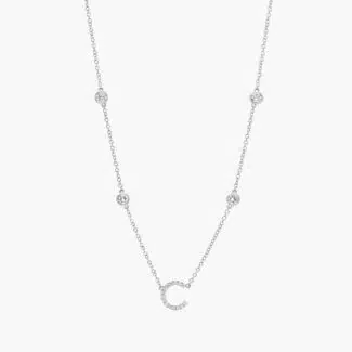 A personalized station initial necklace in 14K White Gold featuring 0.95 CTW lab-grown diamonds in a bezel setting, one of the best Luxury Push Present Ideas.
