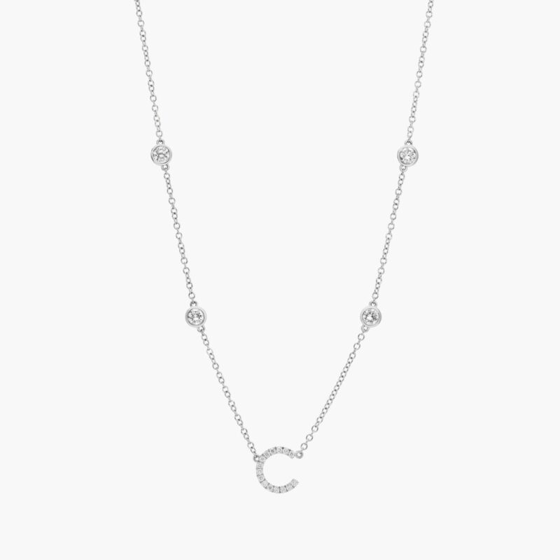 A personalized station initial necklace in 14K White Gold featuring 0.95 CTW lab-grown diamonds in a bezel setting, one of the best Luxury Push Present Ideas.