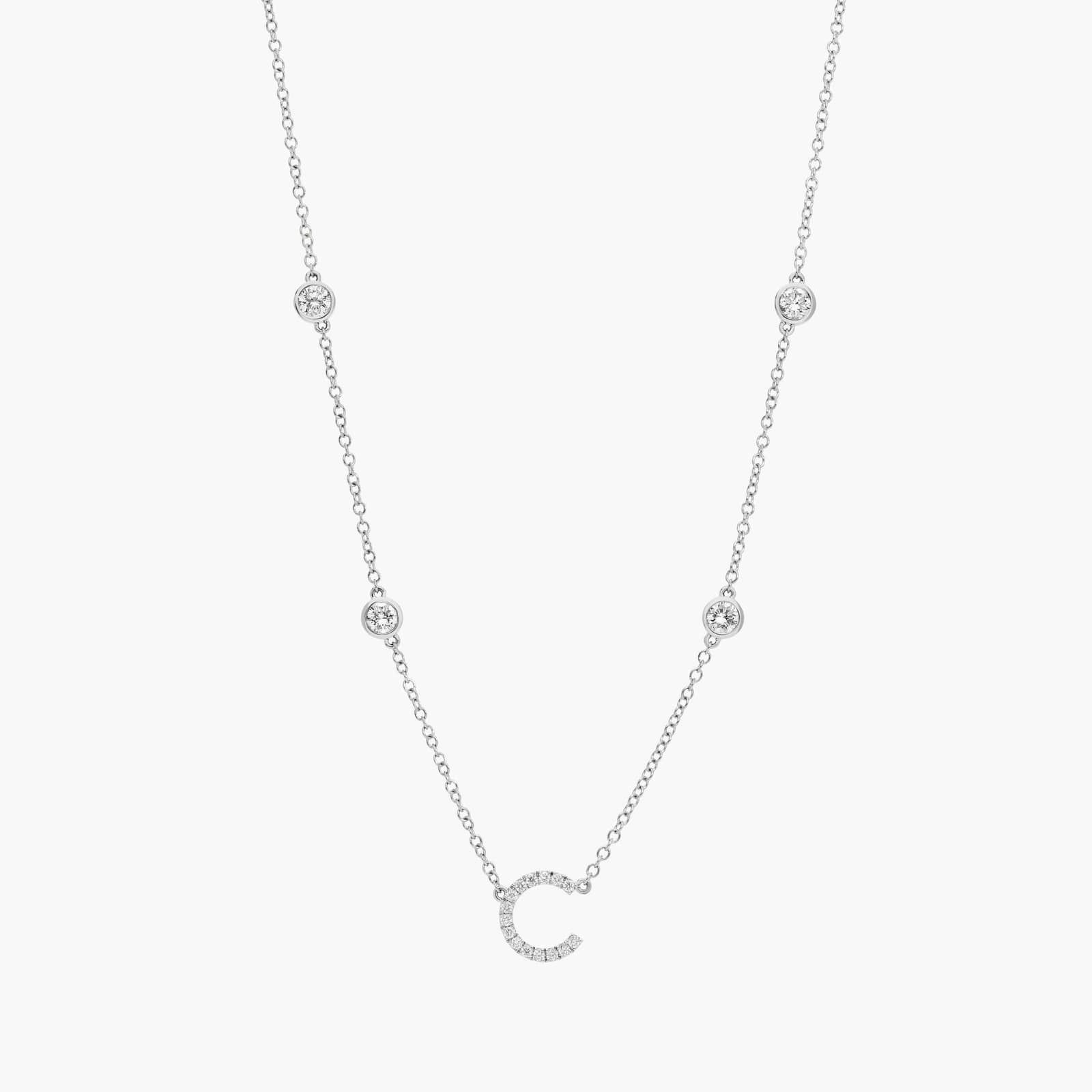 A personalized station initial necklace in 14K White Gold featuring 0.95 CTW lab-grown diamonds in a bezel setting, one of the best Luxury Push Present Ideas.