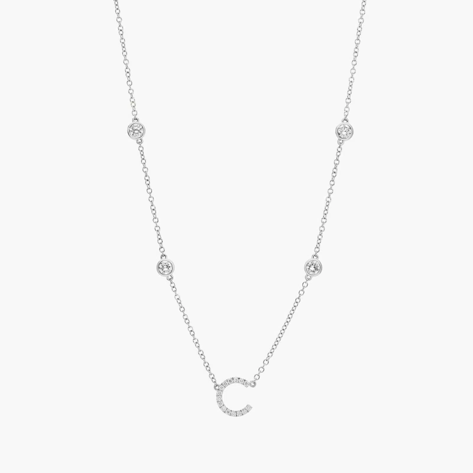 A personalized station initial necklace in 14K White Gold featuring 0.95 CTW lab-grown diamonds in a bezel setting, one of the best Luxury Push Present Ideas.