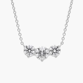 A Premier Three-Stone Diamond Necklace in Platinum, 1 1/2 CTW E-F/VS2 diamonds, the ultimate choice for Luxury Push Present Ideas.