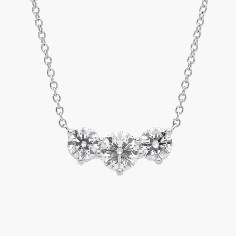 A Premier Three-Stone Diamond Necklace in Platinum, 1 1/2 CTW E-F/VS2 diamonds, the ultimate choice for Luxury Push Present Ideas.