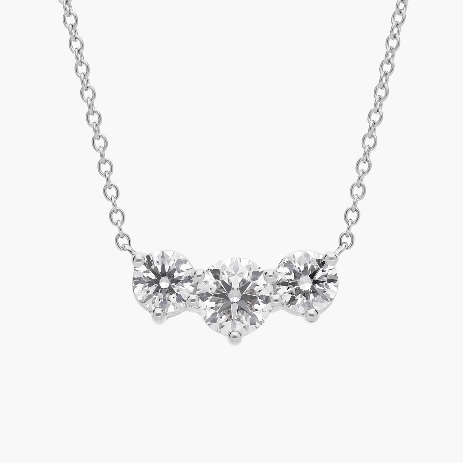 Three-Stone Diamond Necklace in Platinum A Premier Three-Stone Diamond Necklace in Platinum, 1 1/2 CTW E-F/VS2 diamonds, the ultimate choice for Luxury Push Present Ideas.