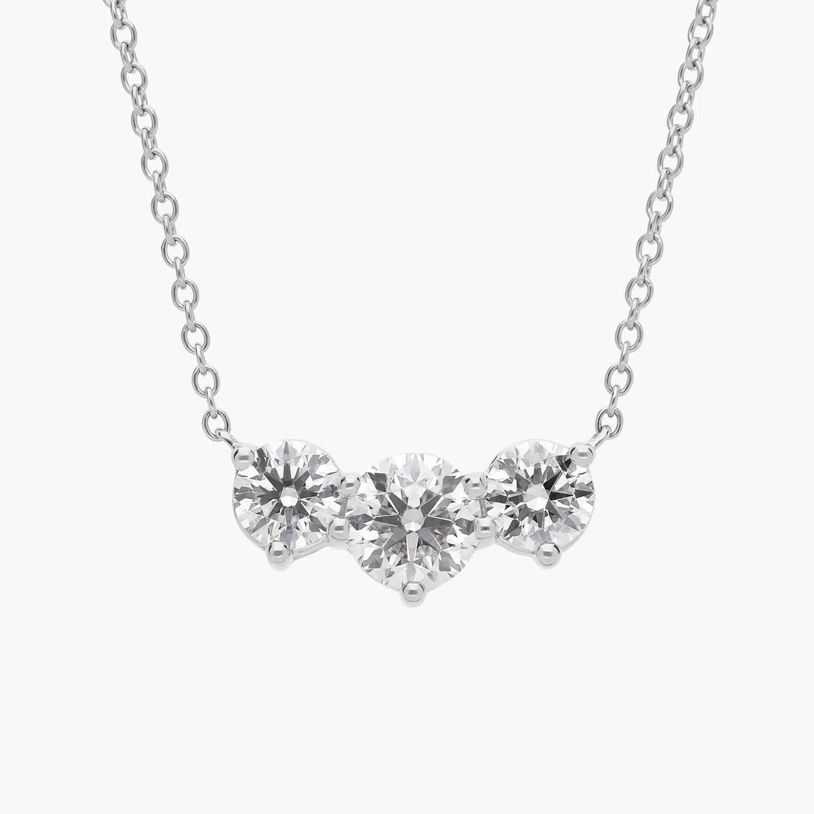 Three-Stone Diamond Necklace in Platinum A Premier Three-Stone Diamond Necklace in Platinum, 1 1/2 CTW E-F/VS2 diamonds, the ultimate choice for Luxury Push Present Ideas.