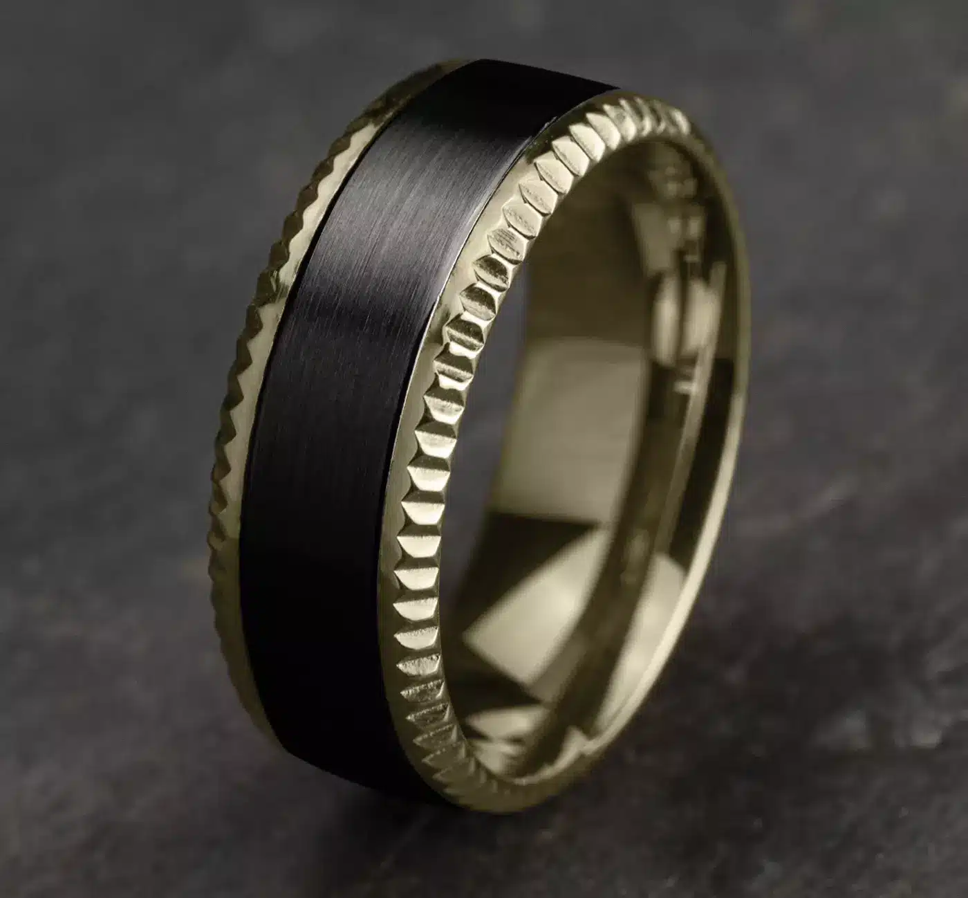 A Bastion Fluted Bevel Black Titanium and 14K Yellow Gold Mens Black Gold Wedding Bands style (8.00mm) with a brushed black center and polished gold edges.