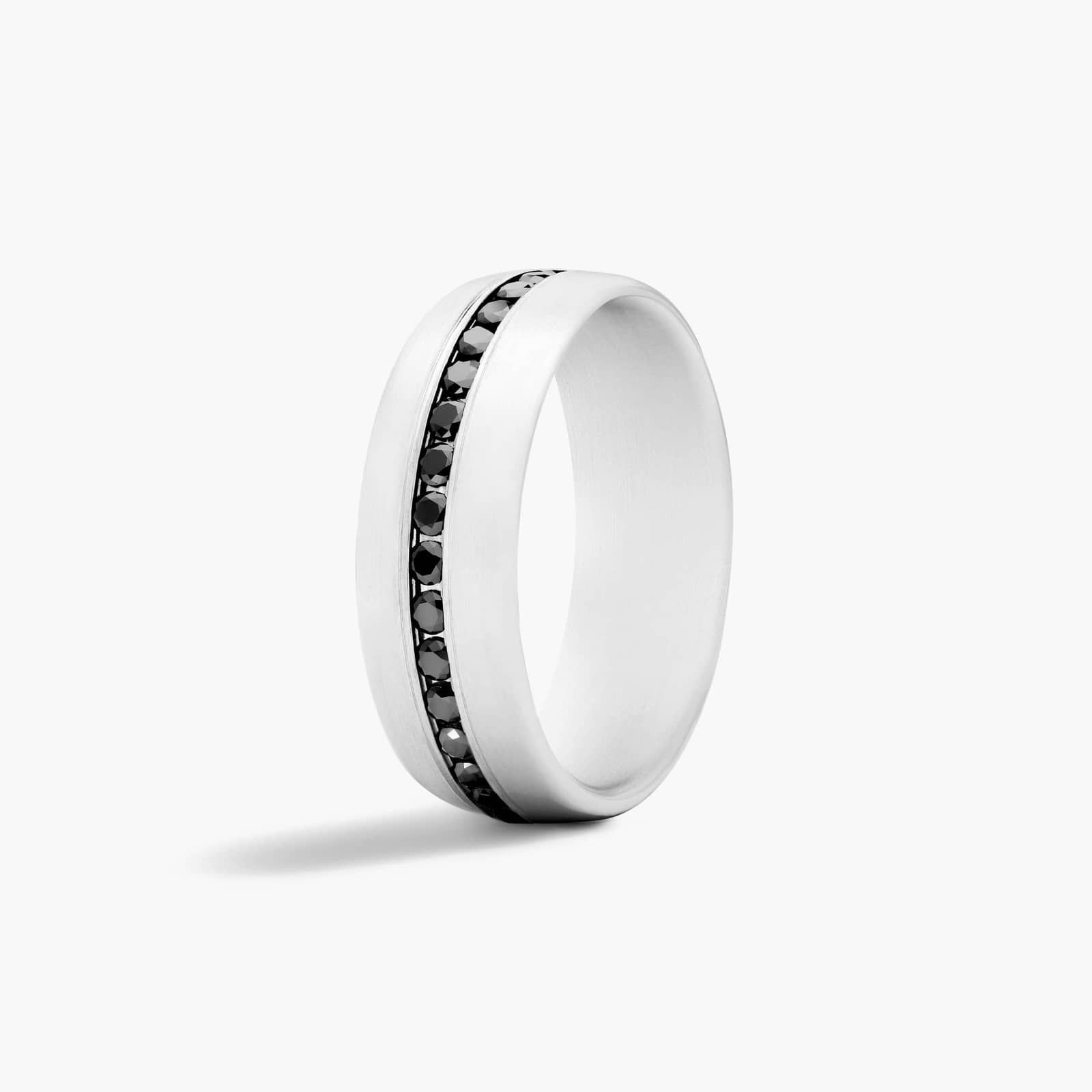 A Comfort Fit Mens White Gold Black Diamond Wedding Bands (7.50mm) in 18K White Gold with 0.40 CTW channel-set Black Diamonds.