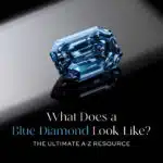 Feature Image: A stunning Fancy Vivid Blue diamond (emerald cut) against a reflective dark background, illustrating "What Does a Blue Diamond Look Like?" This image serves as the ultimate visual guide and resource for understanding the rarity, value, and distinctive blue color of natural blue diamonds, from their unique origins to their status as the most expensive blue gemstone.
