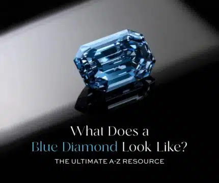 Feature Image: A stunning Fancy Vivid Blue diamond (emerald cut) against a reflective dark background, illustrating "What Does a Blue Diamond Look Like?" This image serves as the ultimate visual guide and resource for understanding the rarity, value, and distinctive blue color of natural blue diamonds, from their unique origins to their status as the most expensive blue gemstone.
