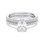 A 1.55 Carat Pear Shape Ring With Wedding Band set in White Gold, featuring a 1.00 CT Pear-shaped diamond engagement ring and a diamond-accented matching wedding band.