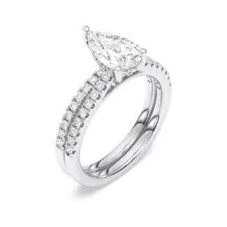 A 1.55 Carat Pear Shape Ring With Wedding Band set in White Gold, featuring a 1.00 CT Pear-shaped diamond engagement ring and a diamond-accented matching wedding band.
