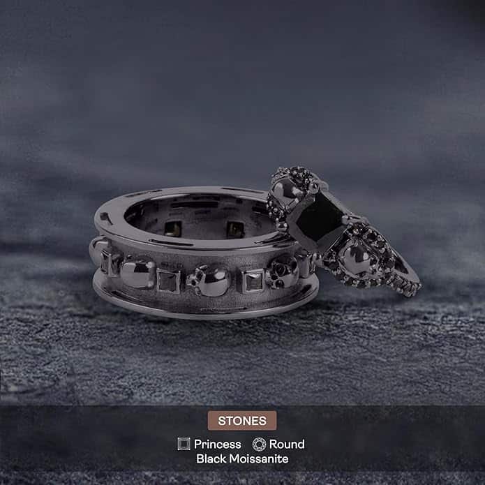 A set of Black Wedding Ring Sets His and Hers featuring a Princess Cut Black Moissanite Skull Engagement Ring and matching wedding band in 925 Sterling Silver with a Gun Metal finish.