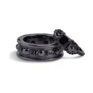 A set of Black Wedding Ring Sets His and Hers featuring a Princess Cut Black Moissanite Skull Engagement Ring and matching wedding band in 925 Sterling Silver with a Gun Metal finish.