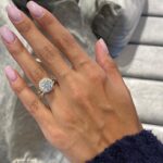 A Vintage Engagement and Wedding Ring Sets in 14K Yellow Gold featuring a 3.00 Carat Moissanite solitaire and a 0.75 Carat Lab Grown Diamond eternity band.