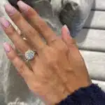 A Vintage Engagement and Wedding Ring Sets in 14K Yellow Gold featuring a 3.00 Carat Moissanite solitaire and a 0.75 Carat Lab Grown Diamond eternity band.