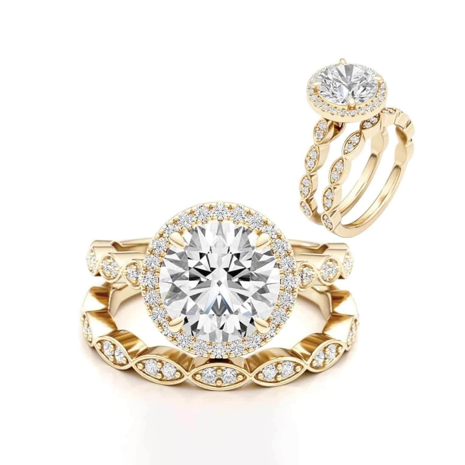 A Vintage Engagement and Wedding Ring Sets in 14K Yellow Gold featuring a 3.00 Carat Moissanite solitaire and a 0.75 Carat Lab Grown Diamond eternity band.