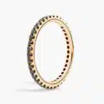 A Riviera Noir Pavé Black Diamond Black Wedding Rings For Women band (1.50mm) in 18K Yellow Gold with 0.50 CTW black diamonds.