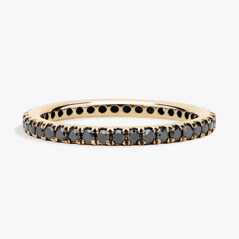 A Riviera Noir Pavé Black Diamond Black Wedding Rings For Women band (1.50mm) in 18K Yellow Gold with 0.50 CTW black diamonds.