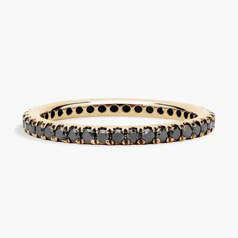 A Riviera Noir Pavé Black Diamond Black Wedding Rings For Women band (1.50mm) in 18K Yellow Gold with 0.50 CTW black diamonds.