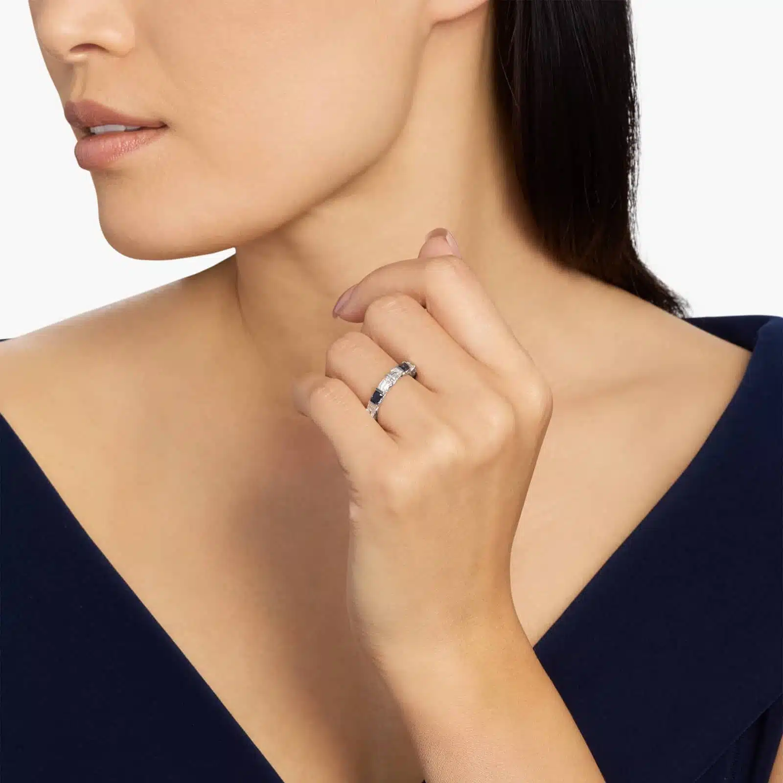 An Alternating East-West Emerald Cut Sapphire and Diamond Blue Wedding Rings For Women band (3.30mm) in 14K White Gold with over 2.5 CTW of stones.