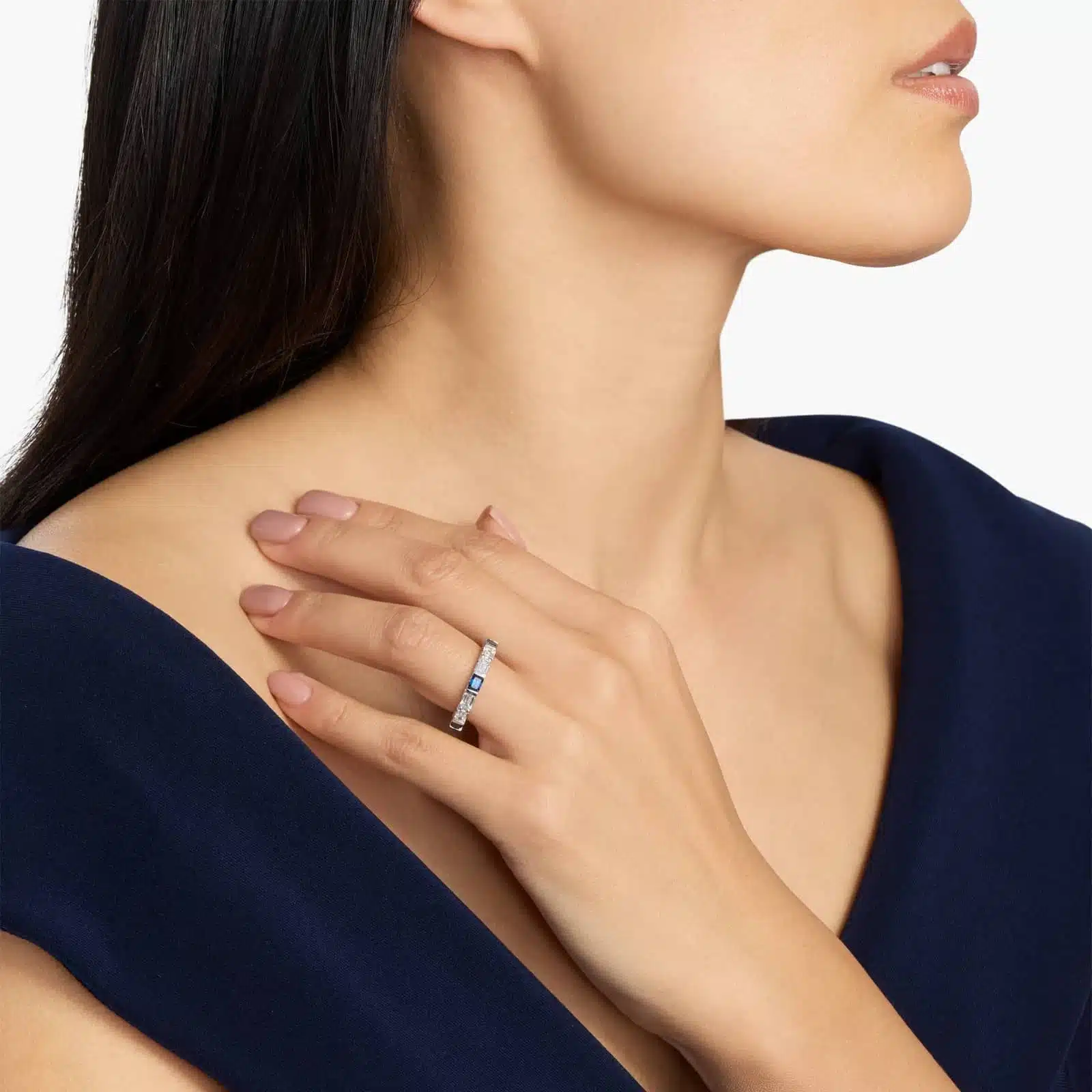 An Alternating East-West Emerald Cut Sapphire and Diamond Blue Wedding Rings For Women band (3.30mm) in 14K White Gold with over 2.5 CTW of stones.