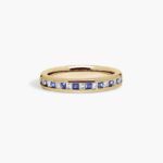 An 18K Yellow Gold Princess Cut Wedding Rings band (4.00 mm) featuring an alternating channel-set pattern of 0.5 CTW natural diamonds and blue sapphires.