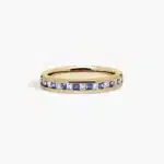 An 18K Yellow Gold Princess Cut Wedding Rings band (4.00 mm) featuring an alternating channel-set pattern of 0.5 CTW natural diamonds and blue sapphires.