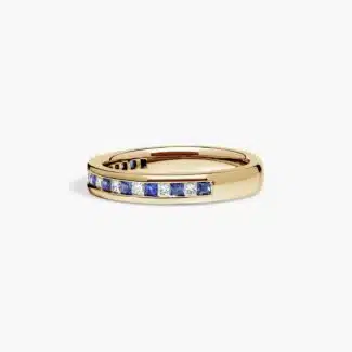 An 18K Yellow Gold Princess Cut Wedding Rings band (4.00 mm) featuring an alternating channel-set pattern of 0.5 CTW natural diamonds and blue sapphires.