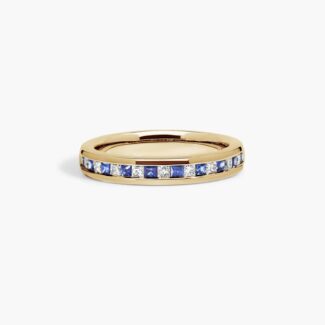 An 18K Yellow Gold Princess Cut Wedding Rings band (4.00 mm) featuring an alternating channel-set pattern of 0.5 CTW natural diamonds and blue sapphires.