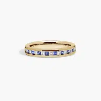 An 18K Yellow Gold Princess Cut Wedding Rings band (4.00 mm) featuring an alternating channel-set pattern of 0.5 CTW natural diamonds and blue sapphires.