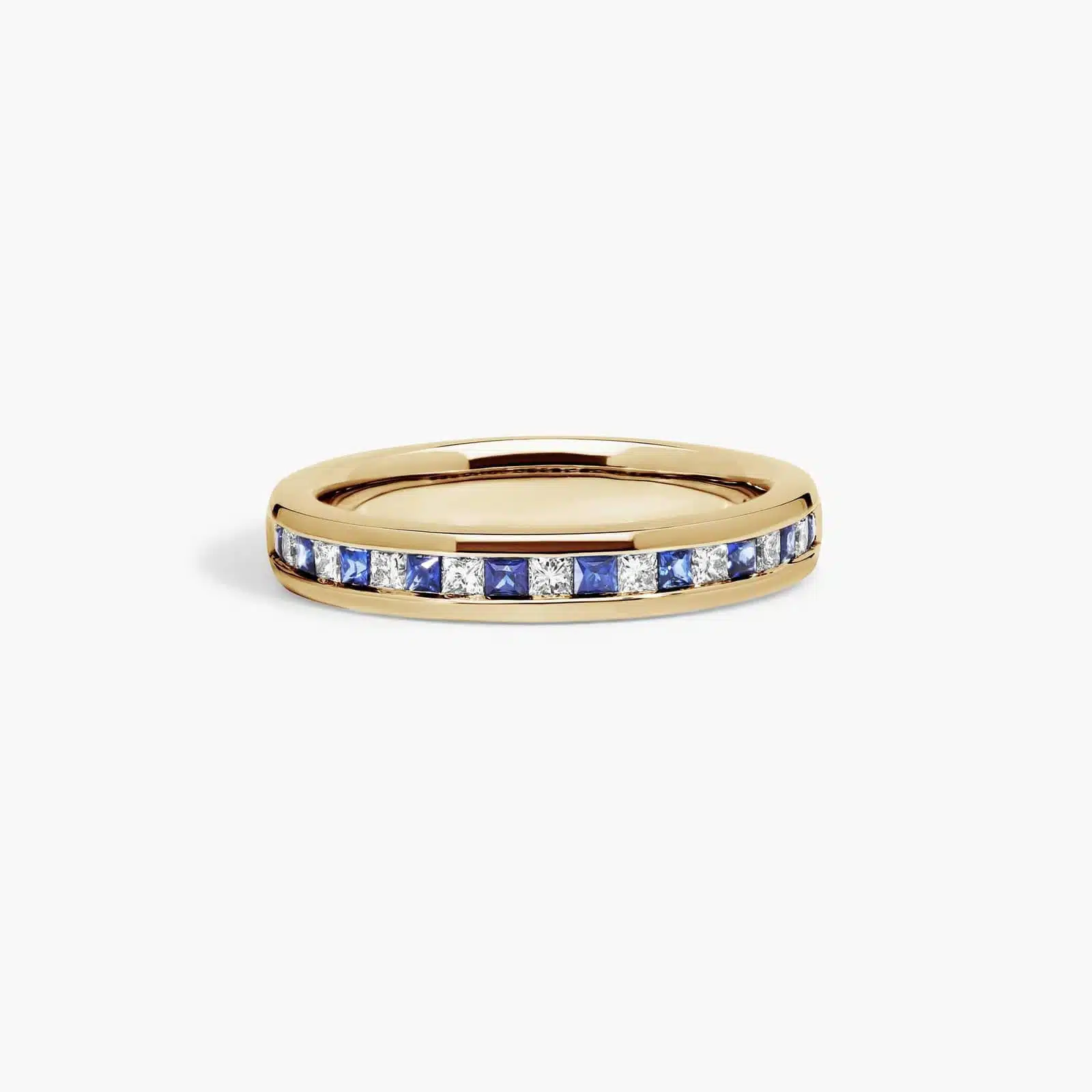 An 18K Yellow Gold Princess Cut Wedding Rings band (4.00 mm) featuring an alternating channel-set pattern of 0.5 CTW natural diamonds and blue sapphires.