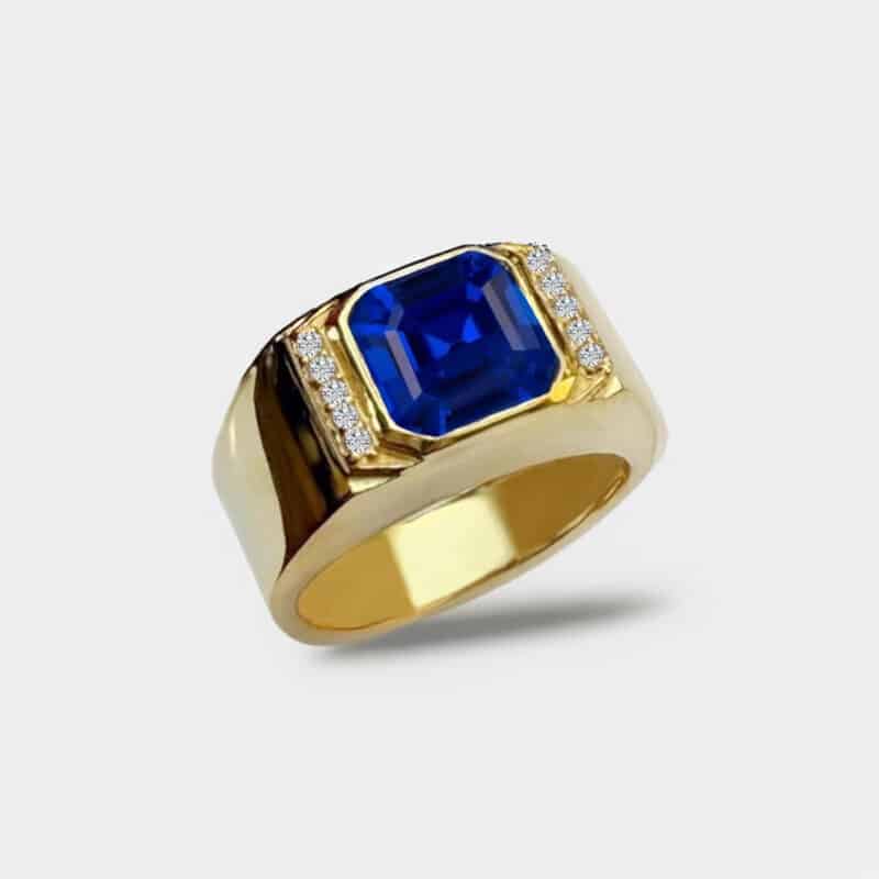 A Yellow Gold Mens Gold Ring With Blue Sapphire featuring a 2 Carat Square Asscher Cut Blue Sapphire set in a secure Bezel Setting, marketed as a men's engagement and wedding ring.